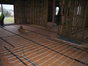 picture of underfloor heating being installed - click for larger image. Opens in new tab